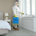 Pest control in hotel industry professional treating a guest room to help prevent pests and maintain clean, safe accommodations.